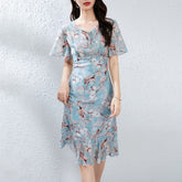 Robe mi-longue en soie pour femme avec col noué et manches flottantes, motif floral